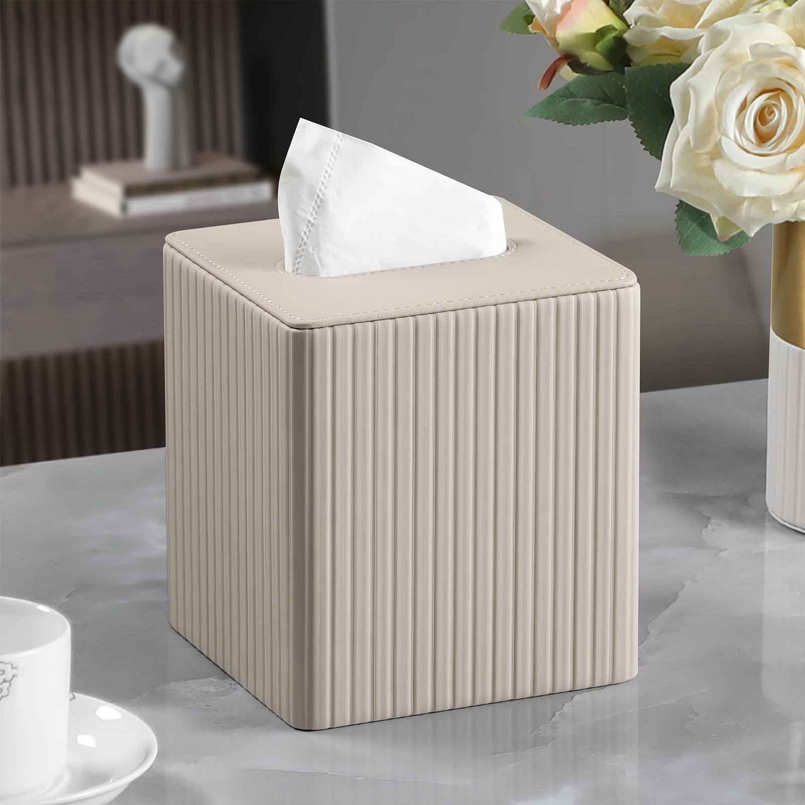 A Square Tissue Box in Elegant Colors, Made of PU Leather, Featuring a Magnetic Closure at The Bottom, with a Striped Decorative Surface, Suitable for Bathrooms, Bedrooms, Or Offices.