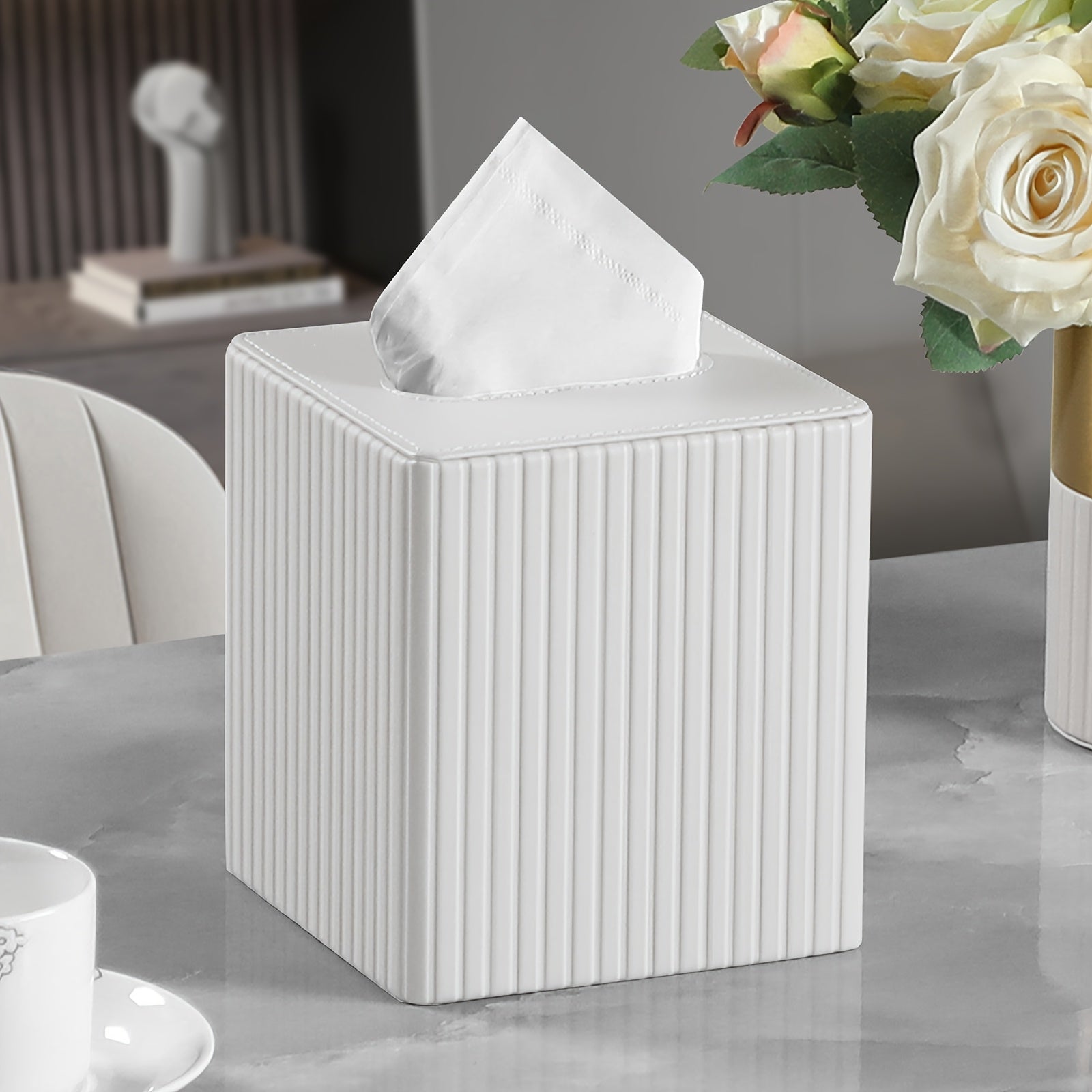 A Square Tissue Box in Elegant Colors, Made of PU Leather, Featuring a Magnetic Closure at The Bottom, with a Striped Decorative Surface, Suitable for Bathrooms, Bedrooms, Or Offices.